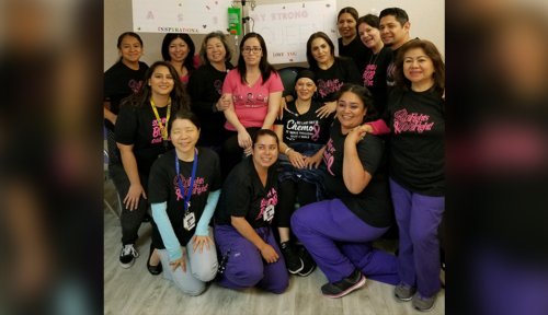 Maribel receiving chemotherapy with her colleagues surrounding her